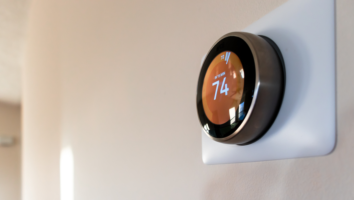nest smart thermostat on a wall